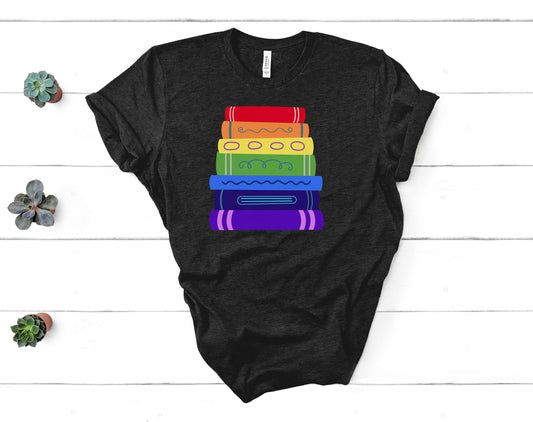 a soft tshirt with an illustrated rainbow colored bookstack